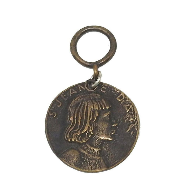 Bronze medallion featuring Joan of Arc profile.
