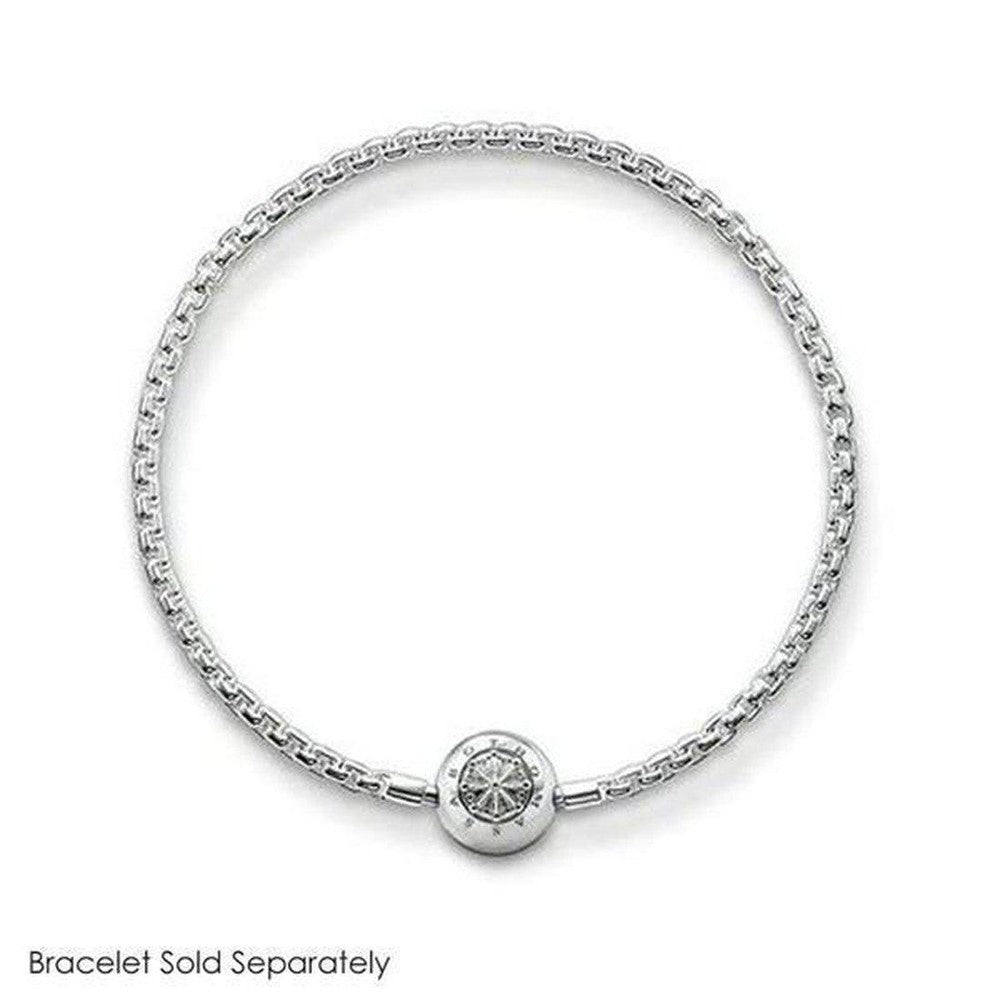 Silver charm featuring an engraved circular design, shown on a delicate chain bracelet (sold separately).