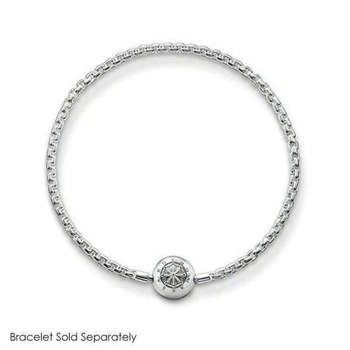 Silver heart charm with pave detailing, shown on a delicate chain bracelet.