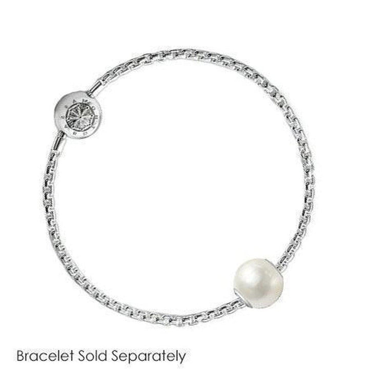 White pearl and silver charm on a delicate chain.