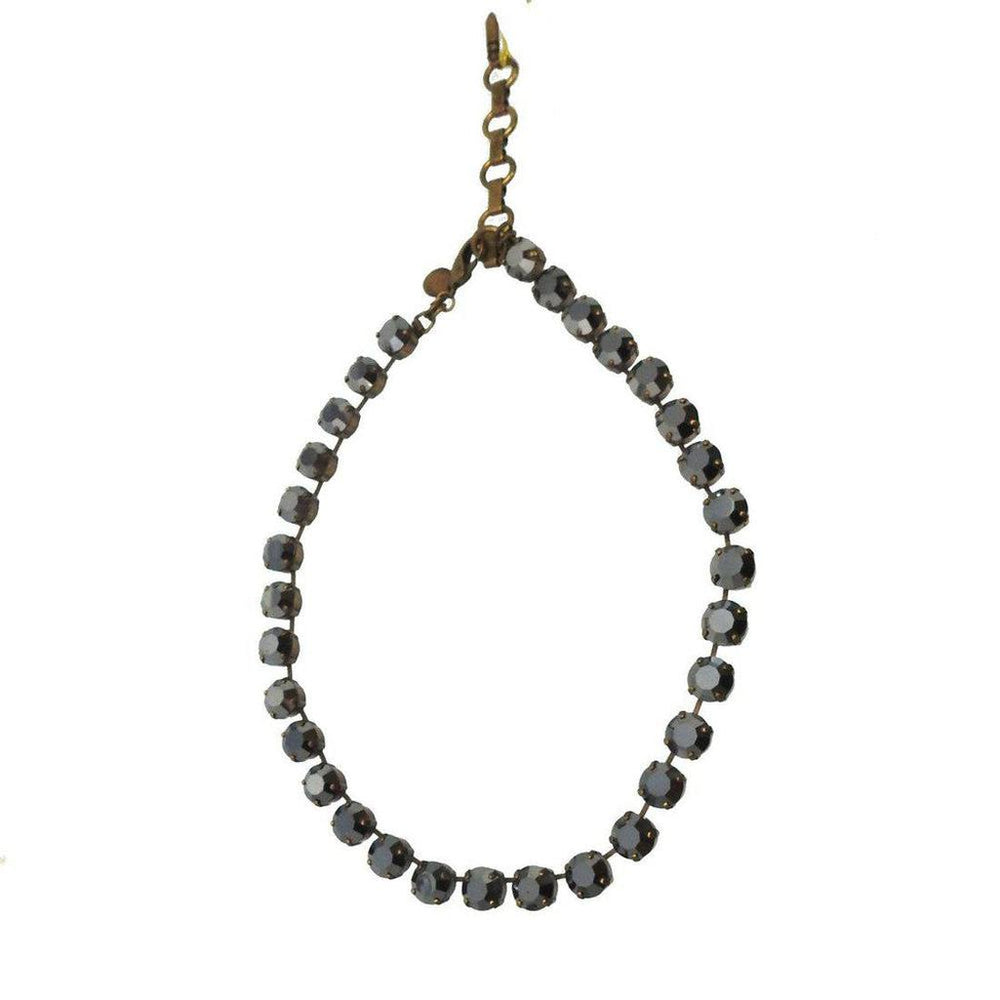 Dark gray crystal necklace on white background