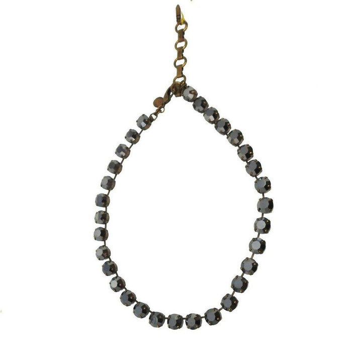 Dark gray crystal necklace on white background