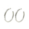 Silver large hoop earrings; modern, minimalist design.