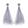 Light gray feather earrings with crystal accents for a glamorous look.