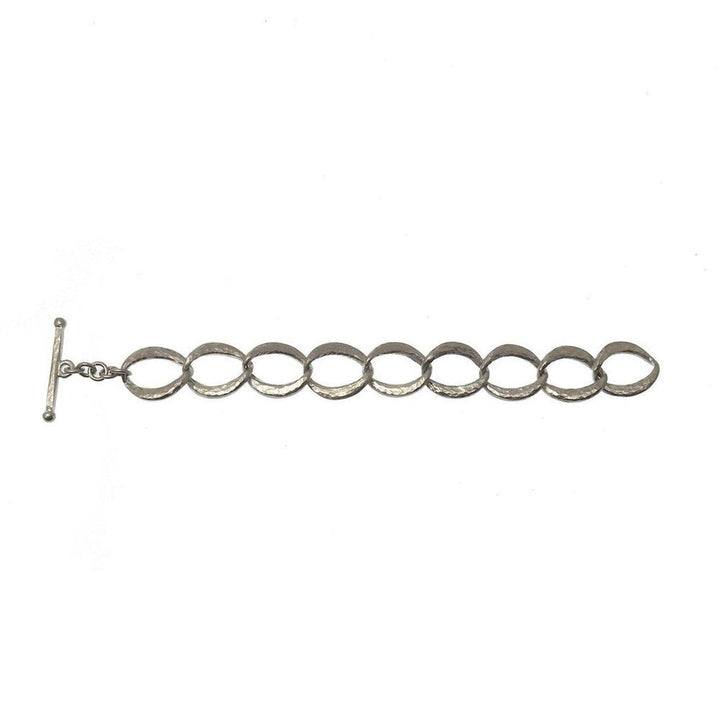 Silver link bracelet with hammered texture, T-bar clasp.