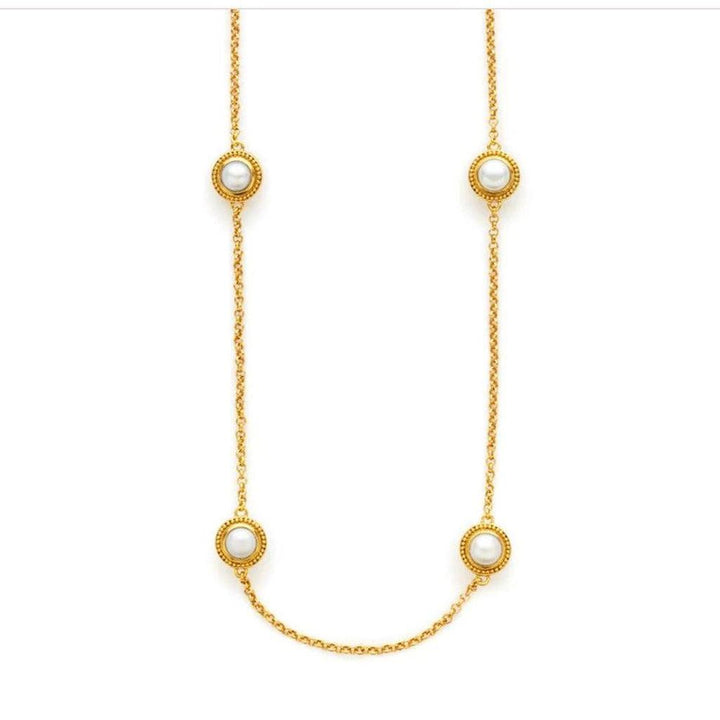 Gold chain necklace featuring three pearl accents.