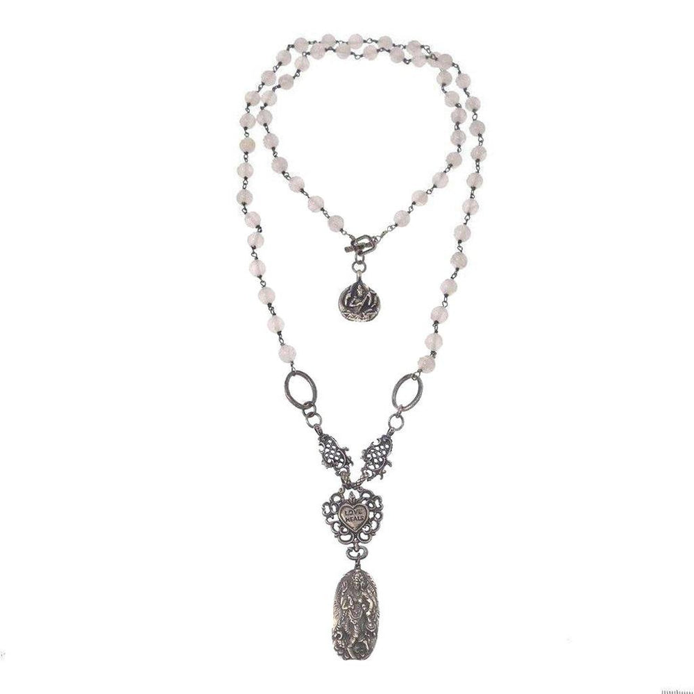 Double-strand beaded necklace with ornate silver pendant; features a heart charm and detailed medallion.