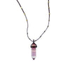 Love Heals Nico Fluorite Pendant: Purple, layered fluorite point on a dark cord necklace with gold accents.