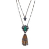 Lucid Tassel Necklace: Double-strand necklace with green stone, gold tassel, and black accents.