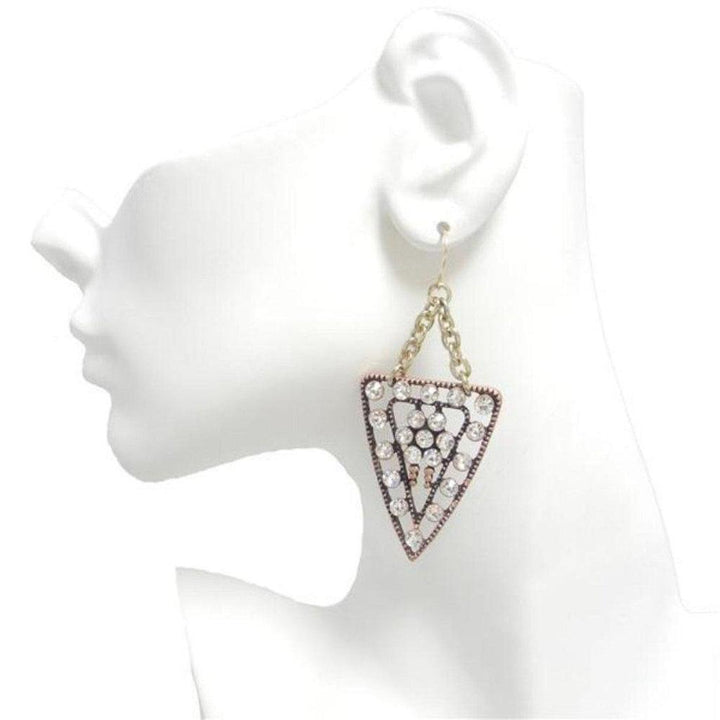 Crystal-studded triangular earrings with antique gold chain; displayed on mannequin.
