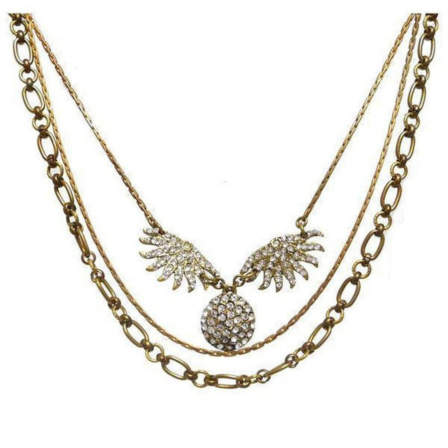 Lulu Frost Heirloom Sunburst necklace: antique gold layered chain with sparkling crystal sunburst pendant.