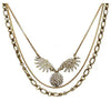 Lulu Frost Heirloom Sunburst necklace: antique gold layered chain with sparkling crystal sunburst pendant.
