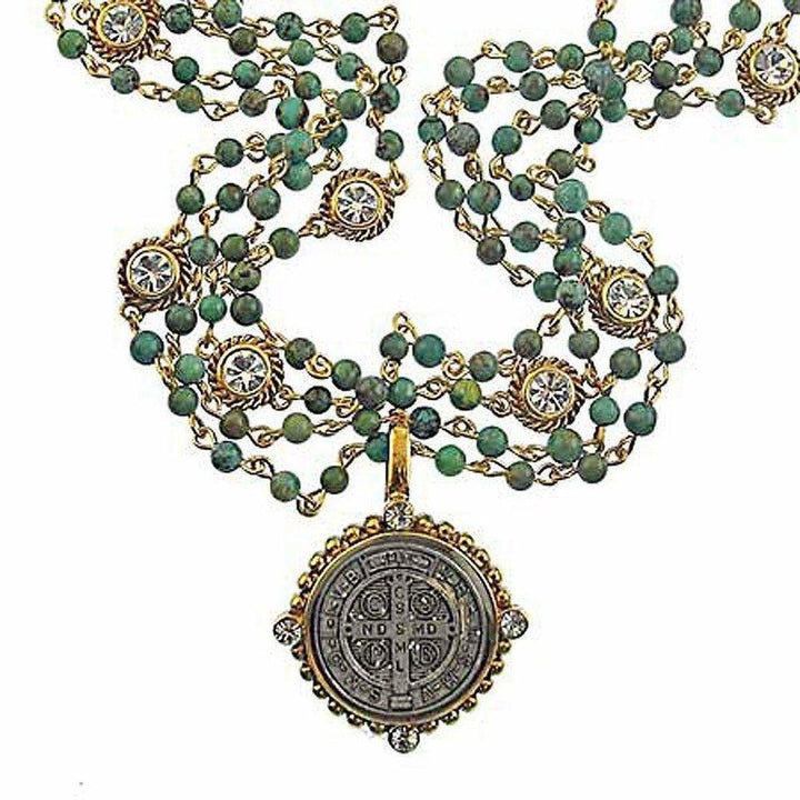 Multi-strand turquoise beaded necklace with gold accents and St. Jude medal pendant.