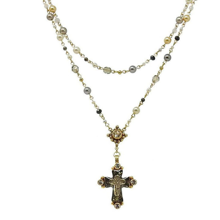 Double-strand pearl rosary necklace with a detailed cross pendant.
