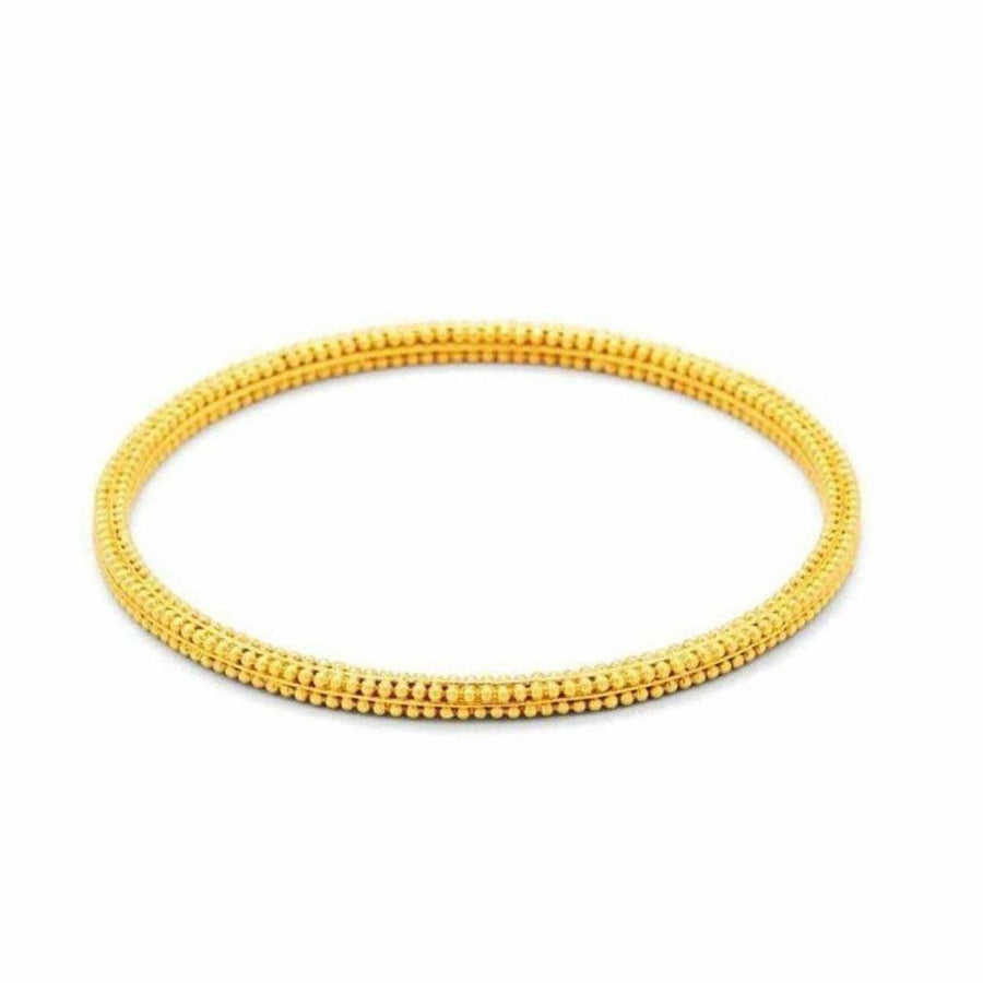 Luxor Gold Stacking Bangle: Elegant gold bangle with textured beaded design.