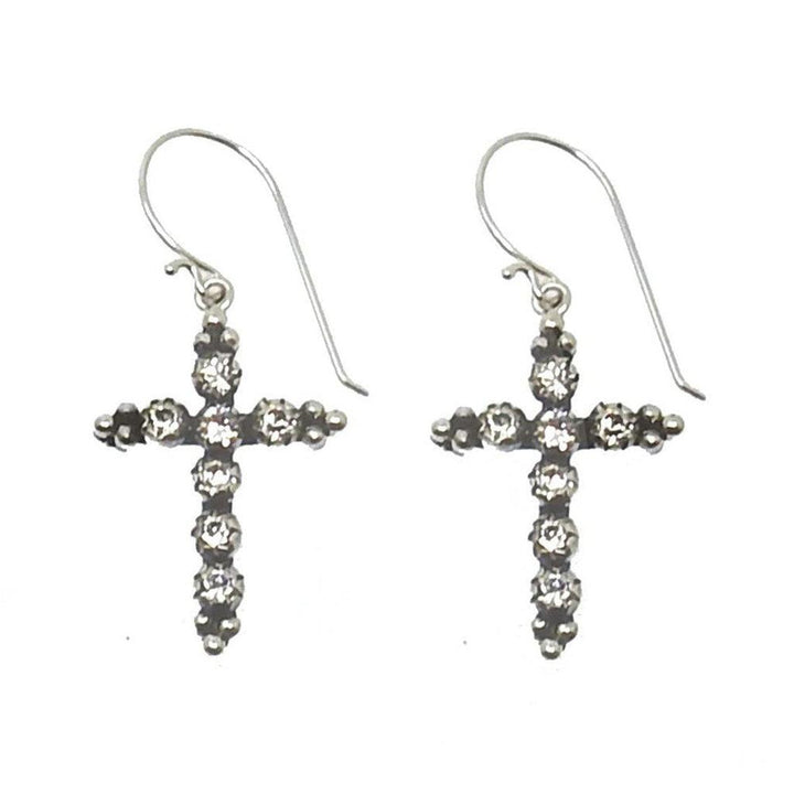 Madonna Cross Hook Earrings: Silver cross earrings adorned with sparkling crystals.