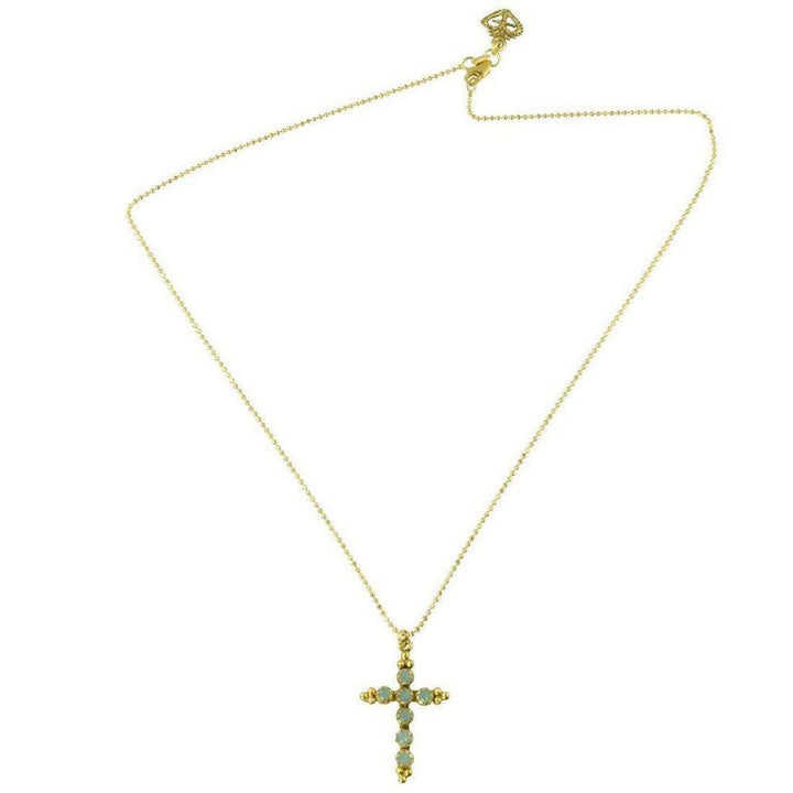 Gold chain necklace featuring a cross pendant adorned with light-blue stones.