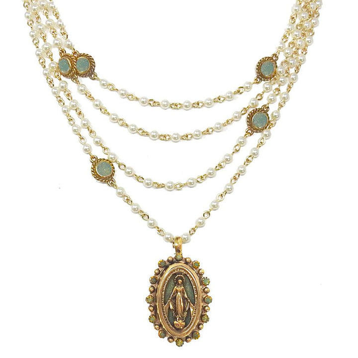 Multi-strand pearl necklace with gold accents and a detailed Virgin Mary pendant.