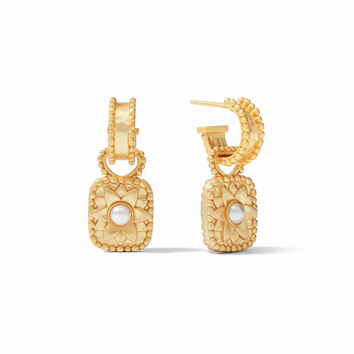 Gold hoop earrings with ornate floral detail and pearl accents.