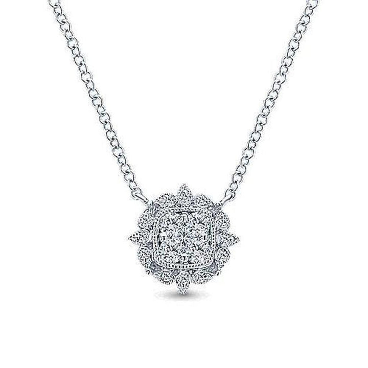 Milgrain diamond pendant necklace with a square-cut cluster of diamonds in a floral setting.
