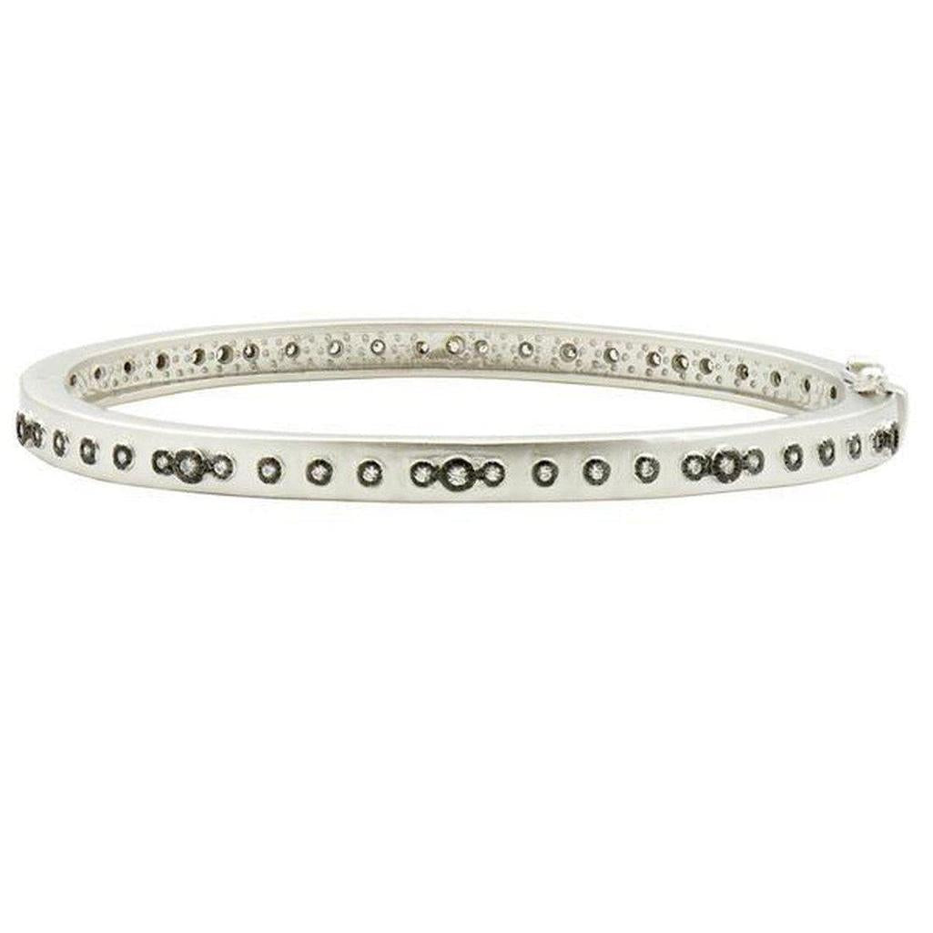 Mini Stud Bezel Stone Hinged Bangle: Silver hinged bangle with pave diamonds and bezel-set stones.