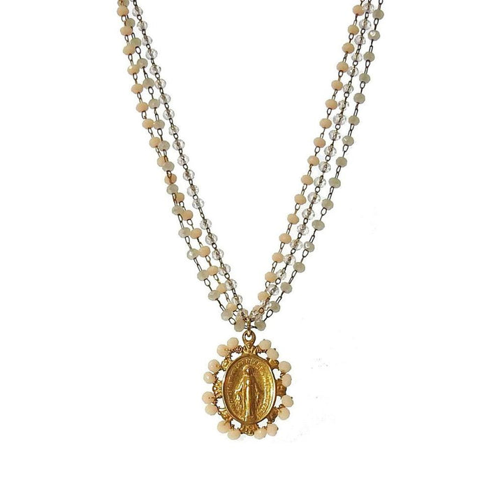 Gold Miraculous Medal necklace on layered beaded chain