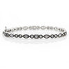 Silver mixed shape bangle featuring marquise, round, and square-cut cubic zirconia stones.