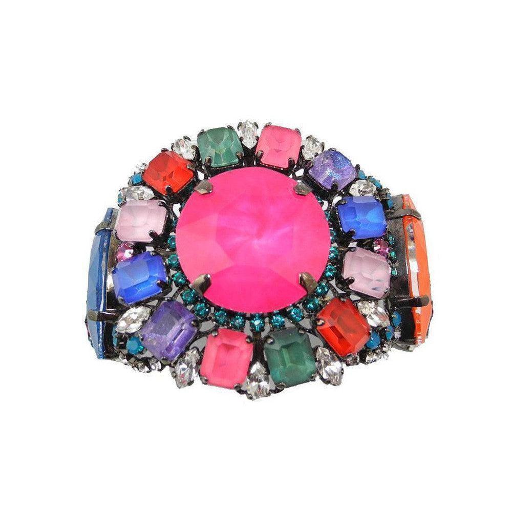 Multicolored gemstone bracelet featuring a large pink centerpiece and smaller surrounding stones in various shapes and colors.