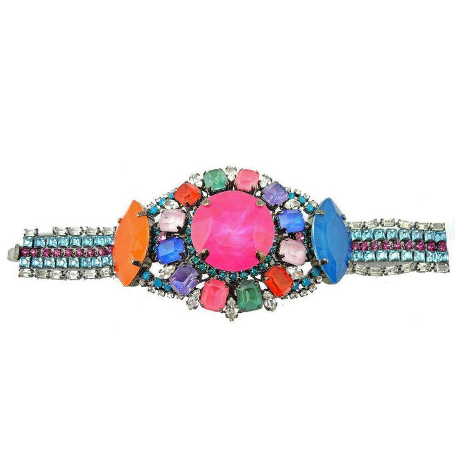 Multicolored crystal Modern Mogul bracelet with large pink centerpiece.