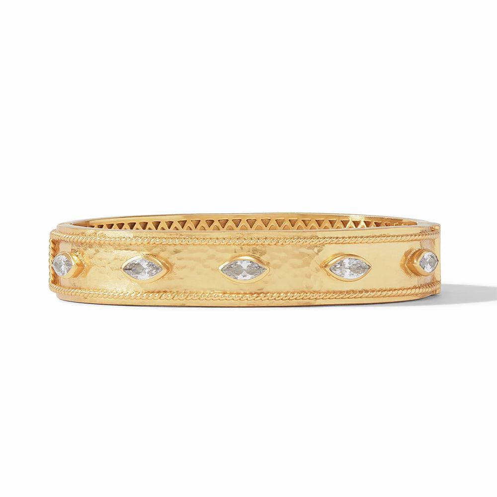 Gold hinged bangle bracelet with clear marquise-cut stones.