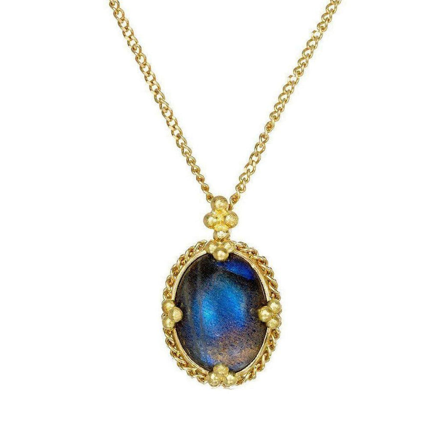 Oval moonstone pendant necklace with gold chain and ornate setting.