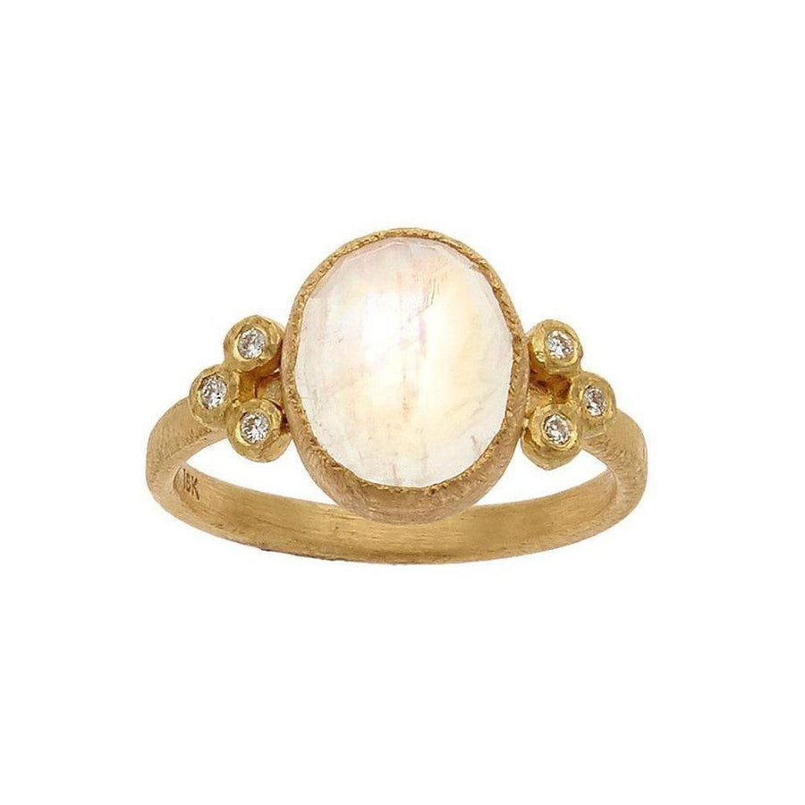 Oval moonstone ring in 18k gold with diamond accents.