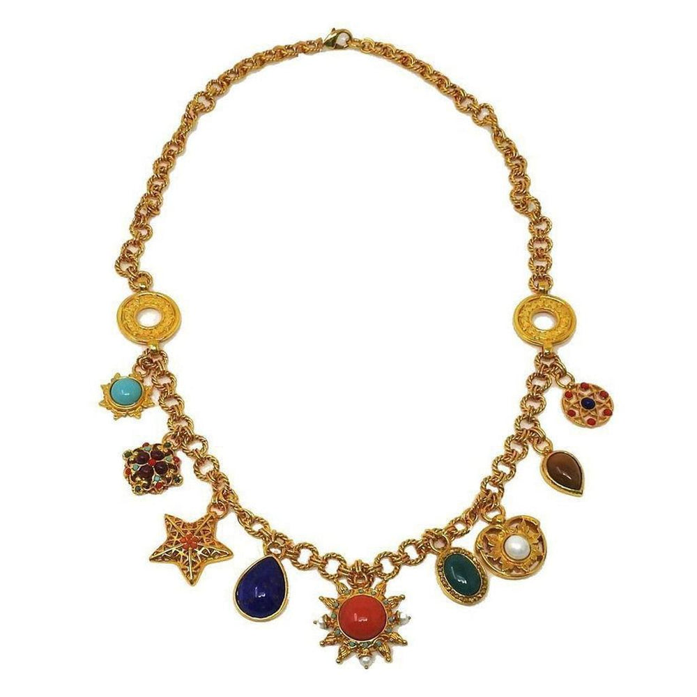 Gold chain necklace adorned with colorful gemstone charms.