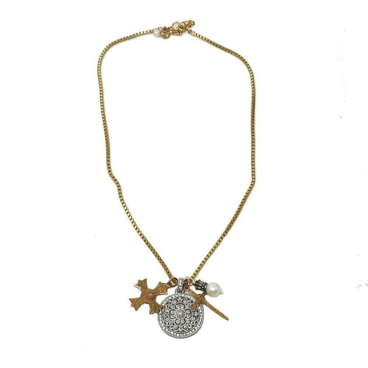Gold chain necklace with ornate cross and pearl accents.
