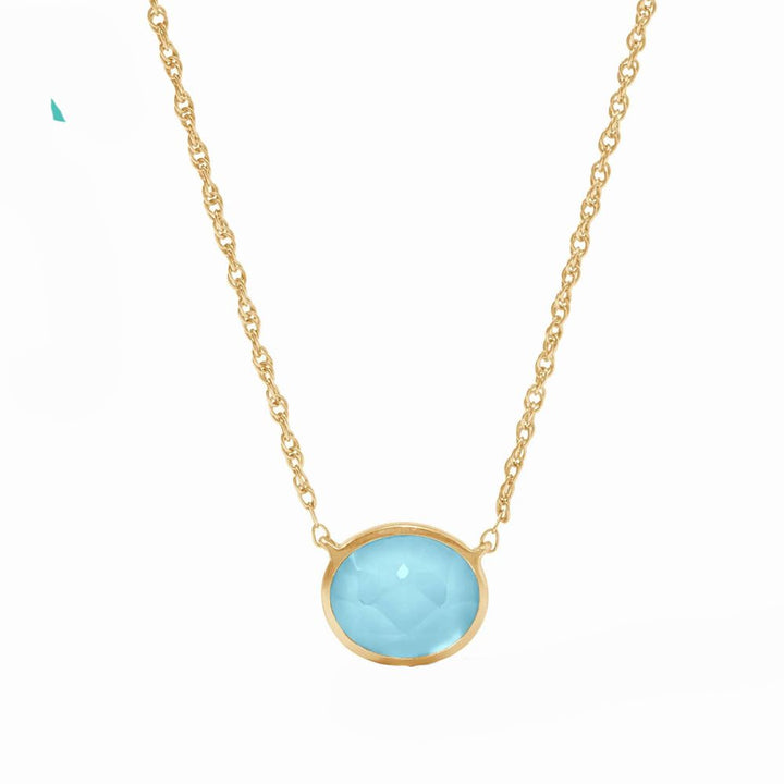 Gold chain necklace featuring a light blue oval gemstone pendant.
