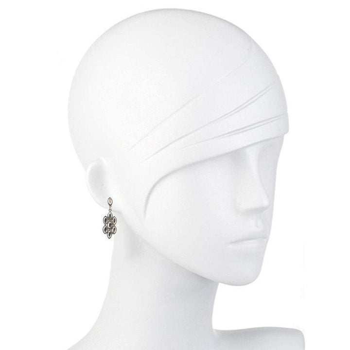 Elegant gray gemstone drop earrings on a mannequin.