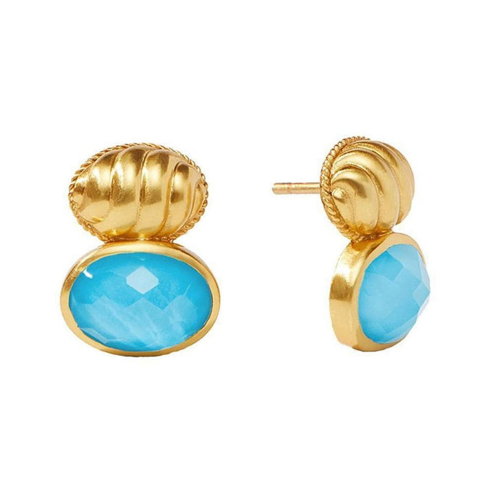 Gold and turquoise statement earrings; detailed close-up.