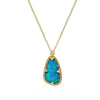 Teardrop opal pendant necklace with gold chain and ornate setting.