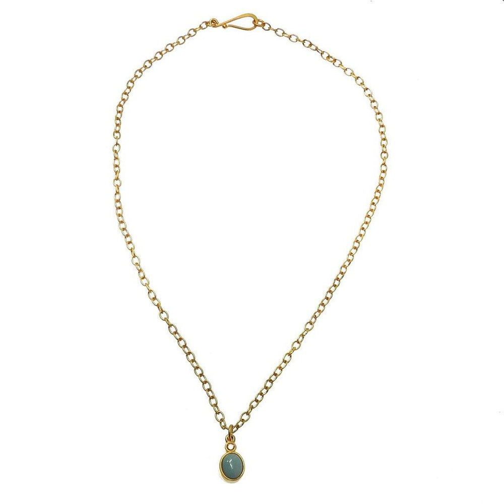 Dainty gold chain necklace featuring a small oval turquoise pendant.