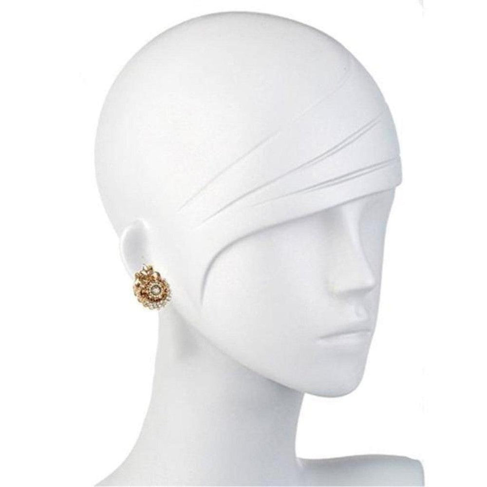 Gold paisley button earrings with sparkling accents on a mannequin.