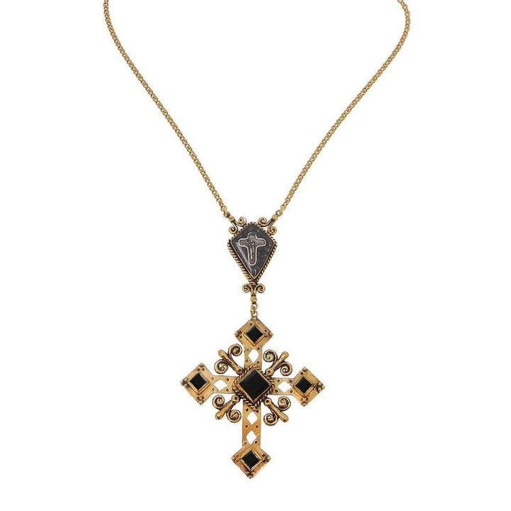 Gold cross necklace with black accents, featuring a detailed pendant and chain.