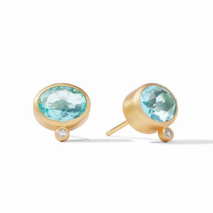 Gold stud earrings featuring oval blue gemstones and small accents.