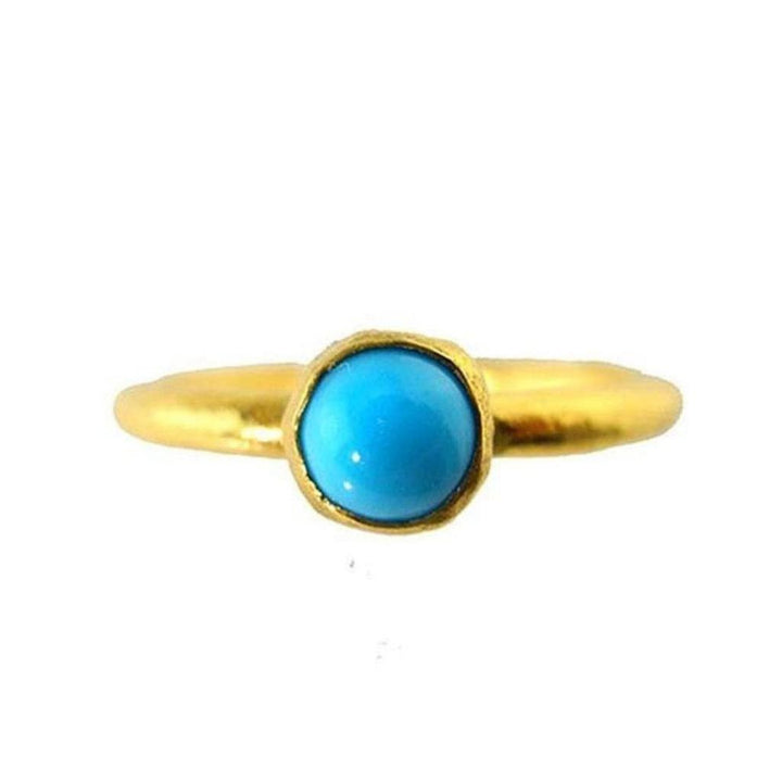 Gold band ring featuring a vibrant turquoise gemstone.