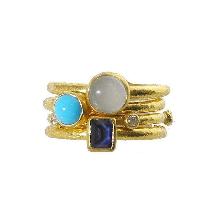 Gold stackable ring featuring turquoise, moonstone, sapphire, and diamond accents.