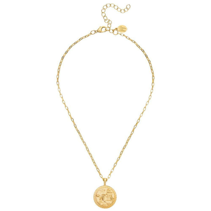 Gold necklace featuring an ornate Asian coin pendant on a delicate chain.