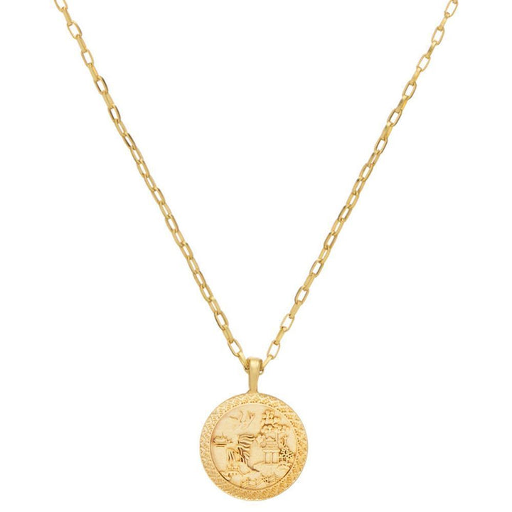 Gold Asian coin pendant necklace with detailed etched design.