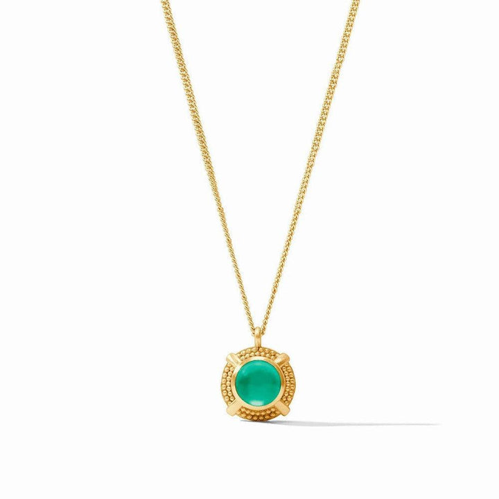 Gold chain necklace featuring a vibrant green cabochon gemstone in a textured gold setting.