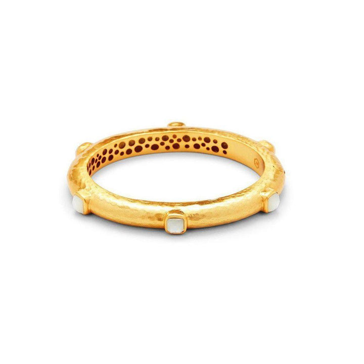 Gold hinged bangle with white gemstone accents.
