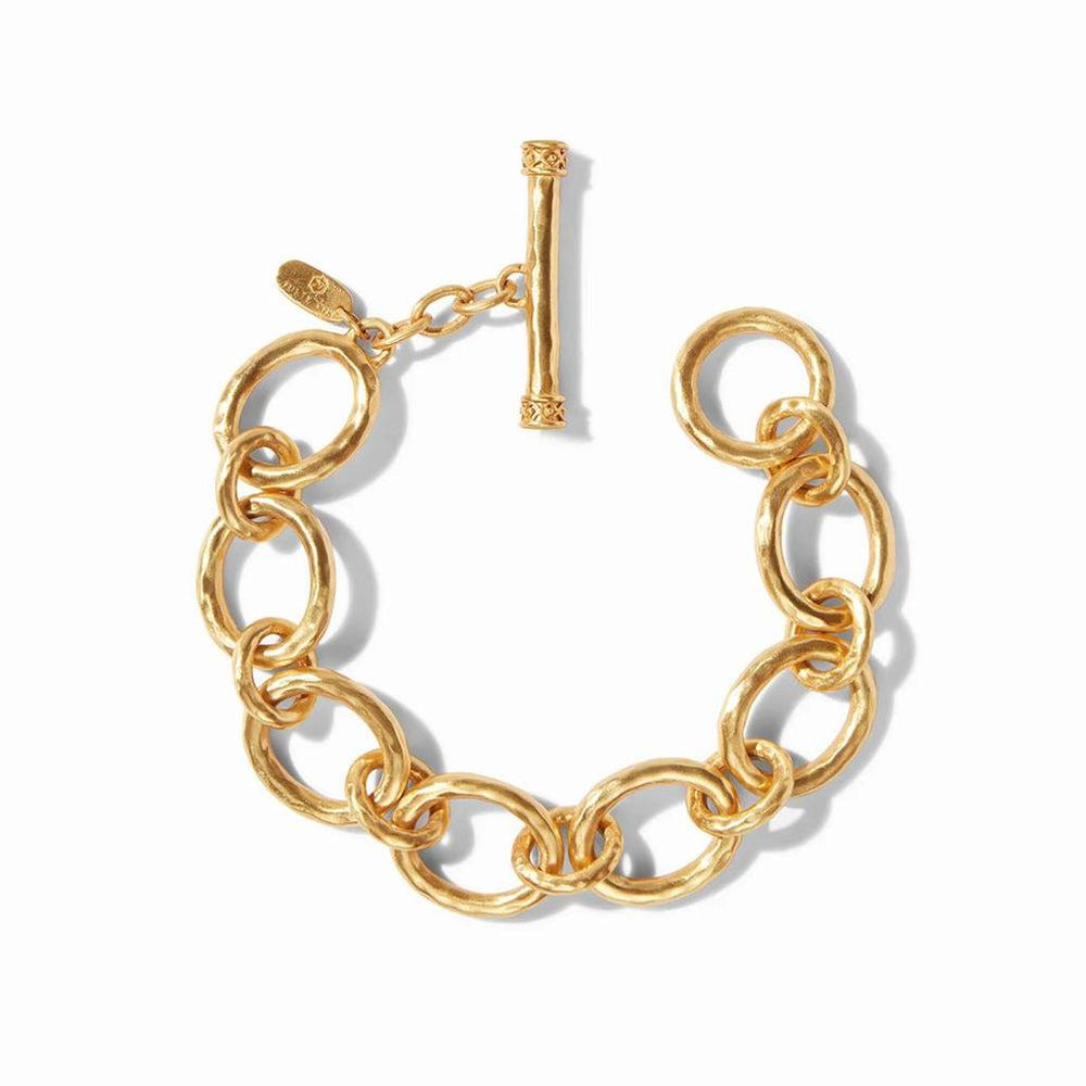 Gold hammered-metal link bracelet with toggle clasp, shown against a white background.