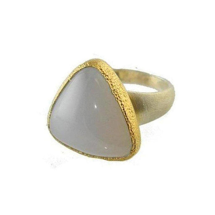 Triangular chalcedony ring with gold-toned setting.